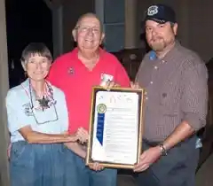 Supervisor Brad Mitzelfelt presents Dennis Casebier with a resolution from the San Bernardino County Board of Supervisors